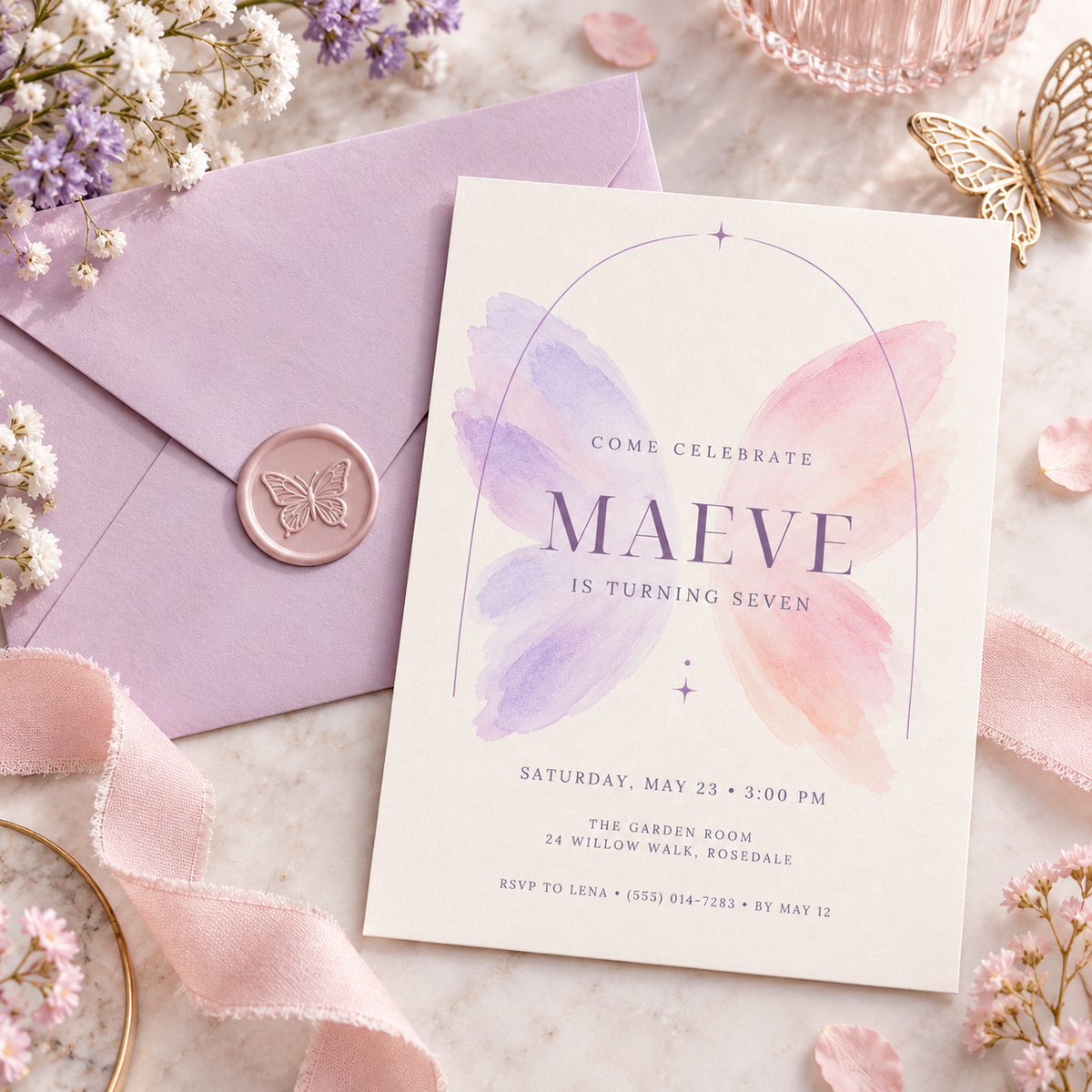Watercolor butterfly invitation beside a lilac envelope with a wax seal