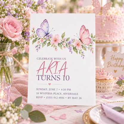 Pink butterfly birthday invitation on a party table beside a birthday cake