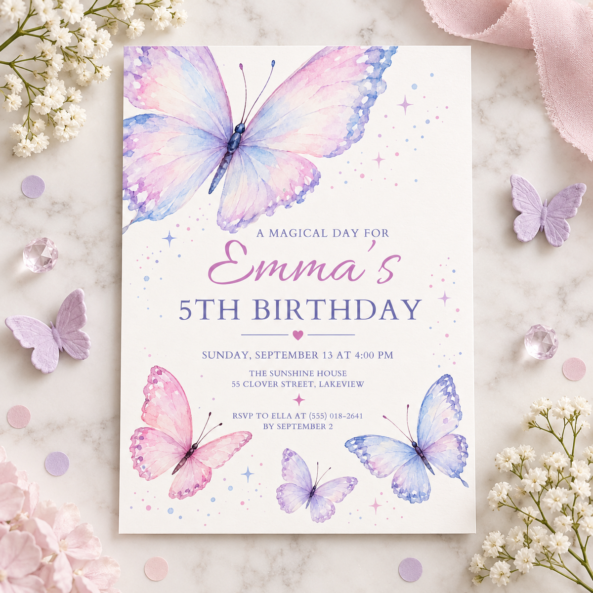 Lavender butterfly birthday invitation on pink fabric with baby's breath