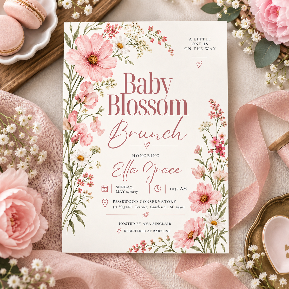 Baby Blossom Brunch invitation on pink satin with macarons and flowers