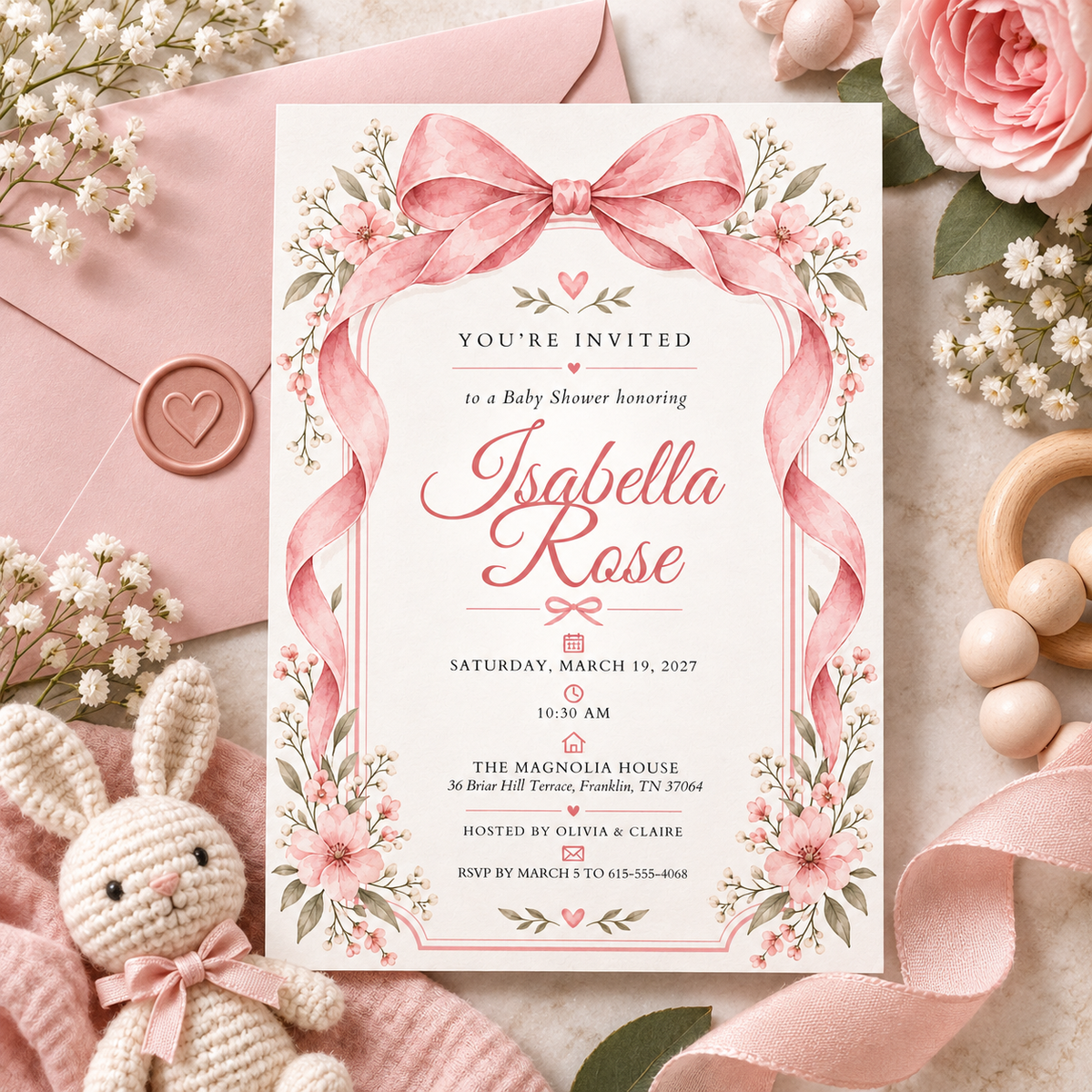 Pink bow baby shower invitation with a pink envelope and plush bunny